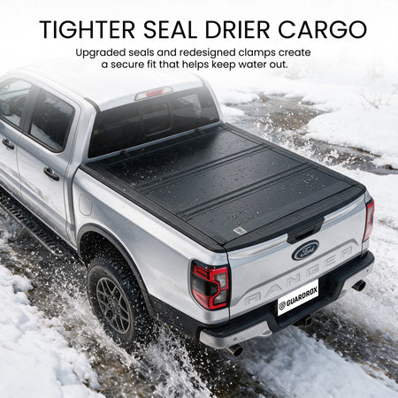 Waterproof flip up tonneau cover with upgraded seals fording a shallow stream