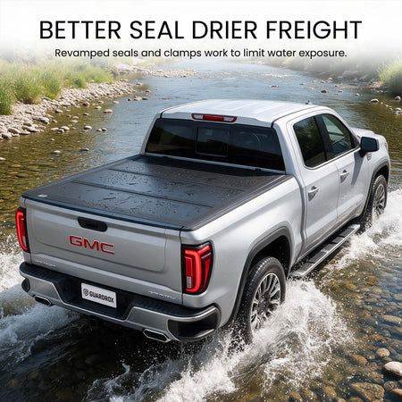 Waterproof hard tri-fold truck bed cover with full-perimeter seals fording a shallow stream