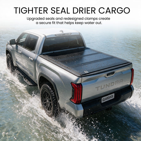 Waterproof flip up tonneau cover with upgraded seals fording a shallow stream