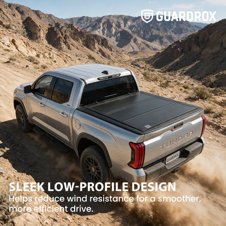 Low profile flip up bed cover riding sleek on a Toyota Tundra cruising a canyon road for less wind drag