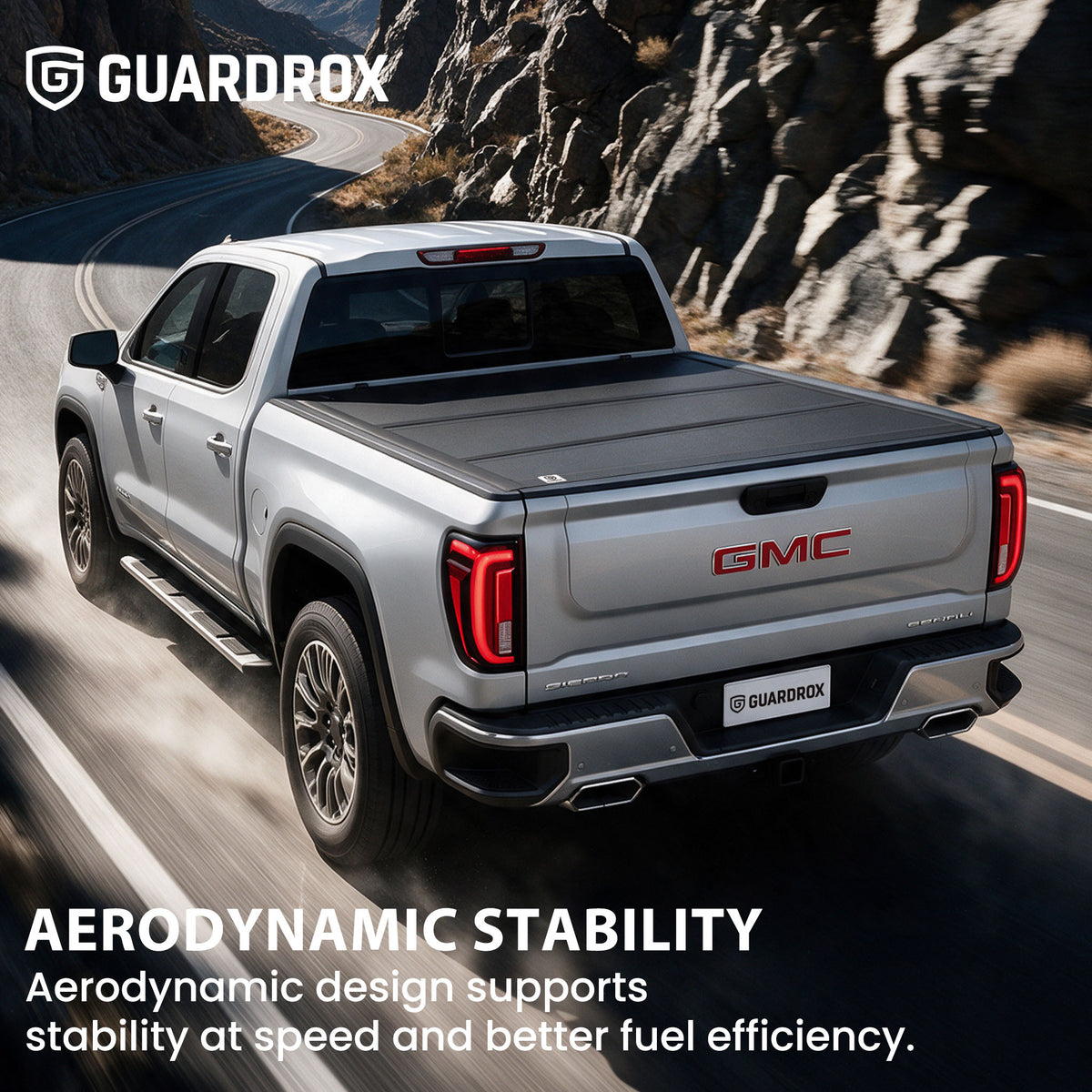Hard truck bed cover riding steady on a pickup cruising a mountain highway for better fuel economy