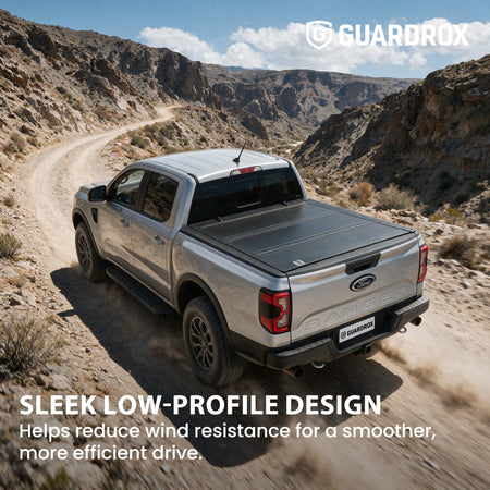 Low profile flip up bed cover riding sleek on a Ford Ranger cruising a canyon road for less wind drag