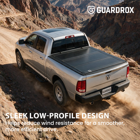 Low profile flip up bed cover riding sleek on a Dodge Ram 1500 Classic cruising a canyon road for less wind drag