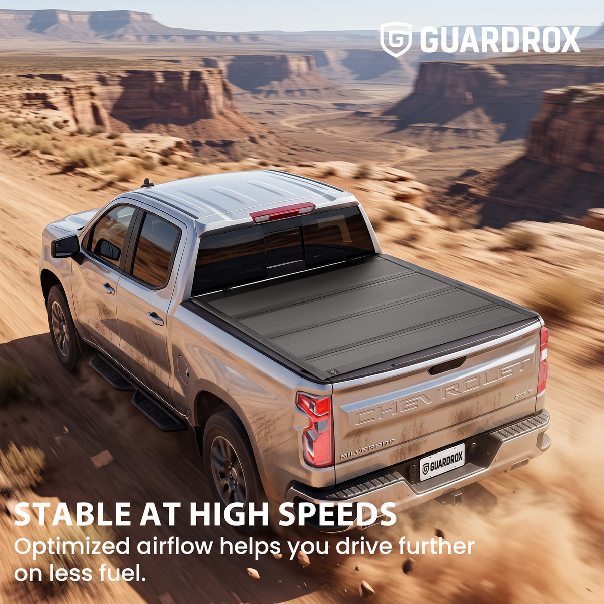 Hard quad-fold tonneau cover riding steady on a Chevy Silverado 1500 cruising a mountain highway for better fuel economy