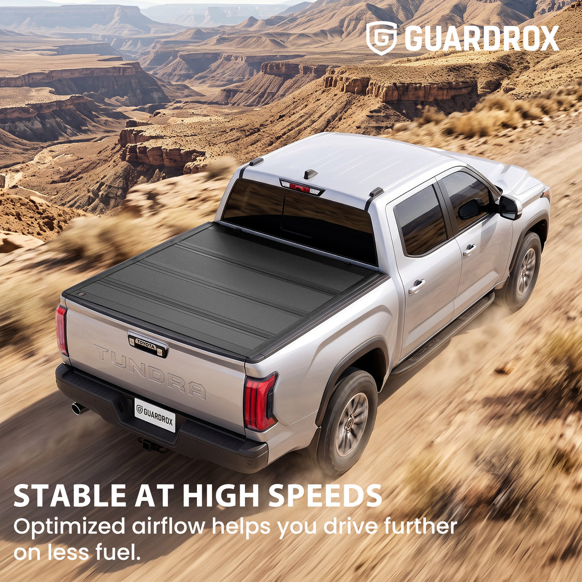 Hard quad-fold tonneau cover riding steady on a Toyota Tundra cruising a mountain highway for better fuel economy