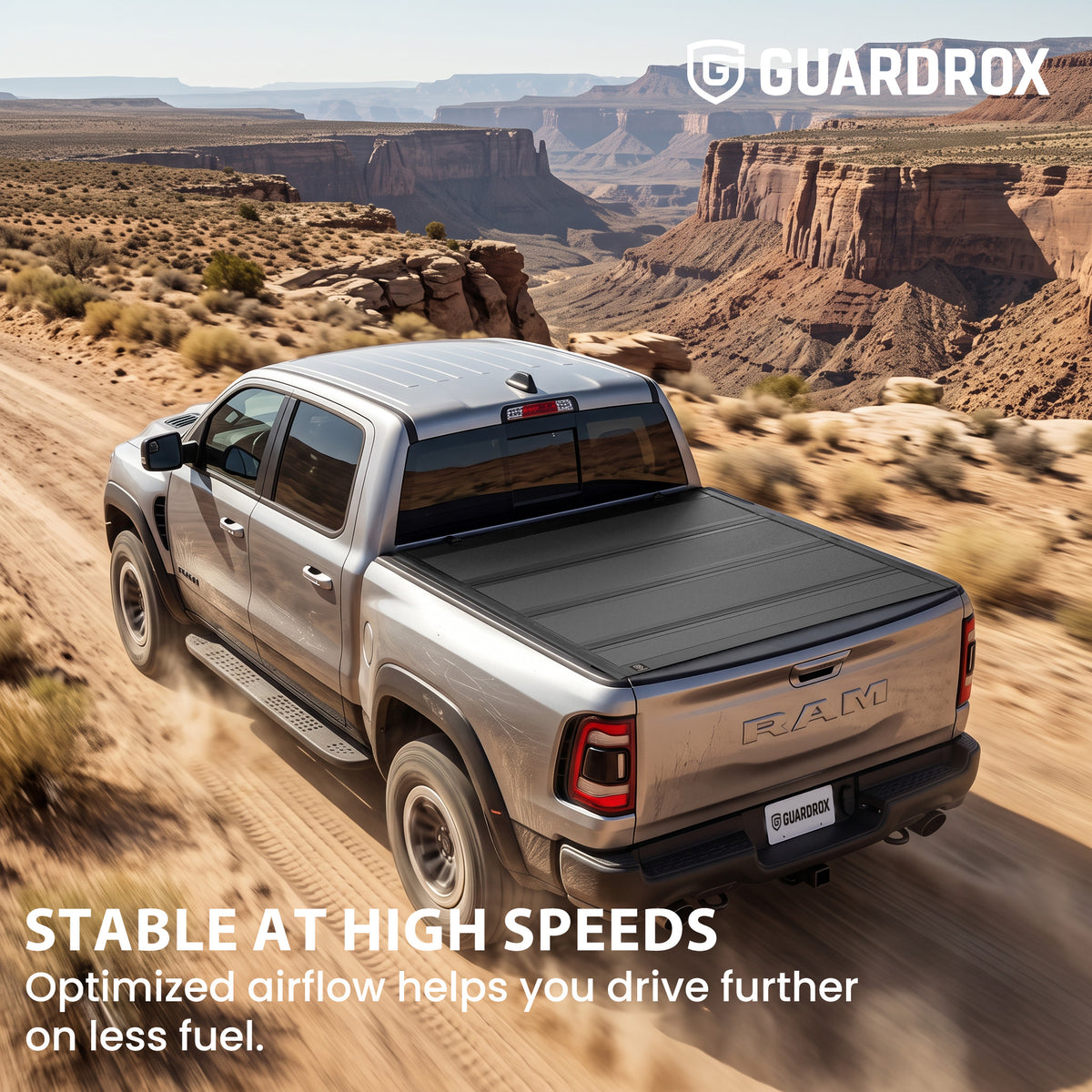 Hard quad-fold tonneau cover riding steady on a RAM 1500 cruising a mountain highway for better fuel economy