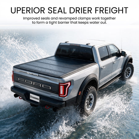 Waterproof hard quad-fold tonneau cover with full-perimeter seals fording a shallow stream