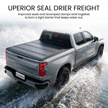 Waterproof hard quad-fold tonneau cover with full-perimeter seals fording a shallow stream