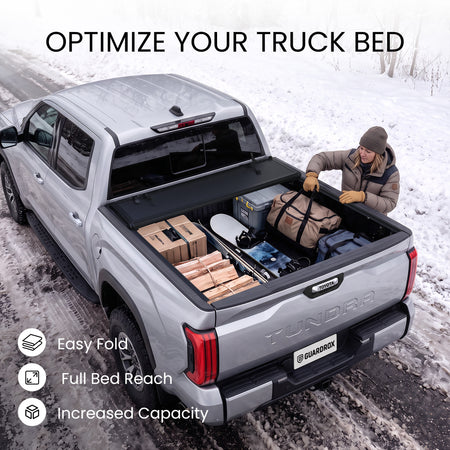Toyota Tundra bed with the L6 cover fully folded against the cab and loaded with bulky cargo