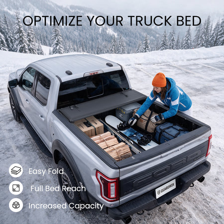 Ford F-150 bed with the L6 cover fully folded against the cab and loaded with bulky cargo