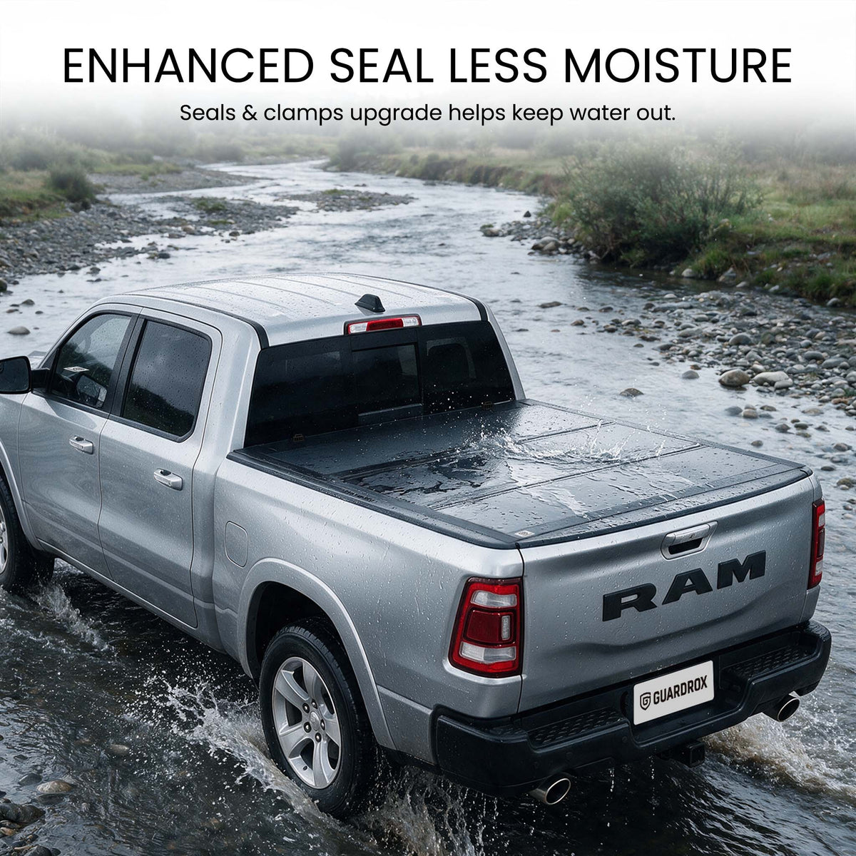Waterproof hard tri-fold truck bed cover with full-perimeter seals fording a shallow stream