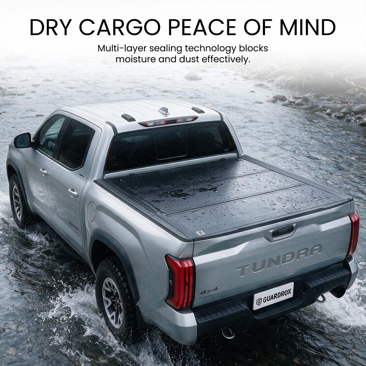 Waterproof hard tri-fold truck bed cover with full-perimeter seals fording a shallow stream
