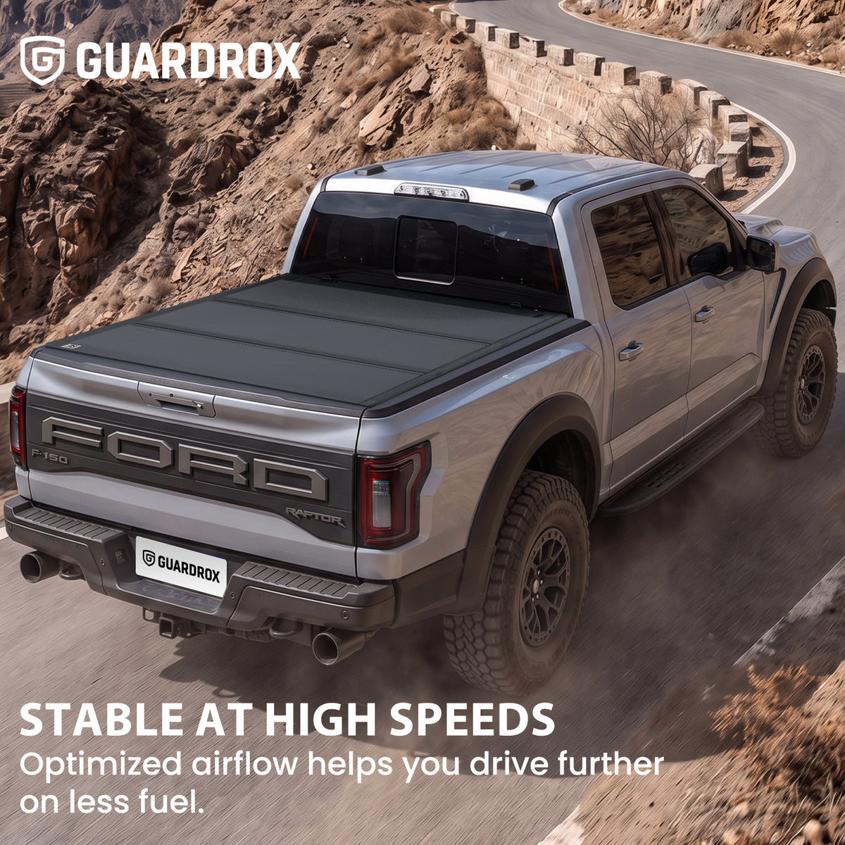 Hard truck bed cover riding steady on a pickup cruising a mountain highway for better fuel economy