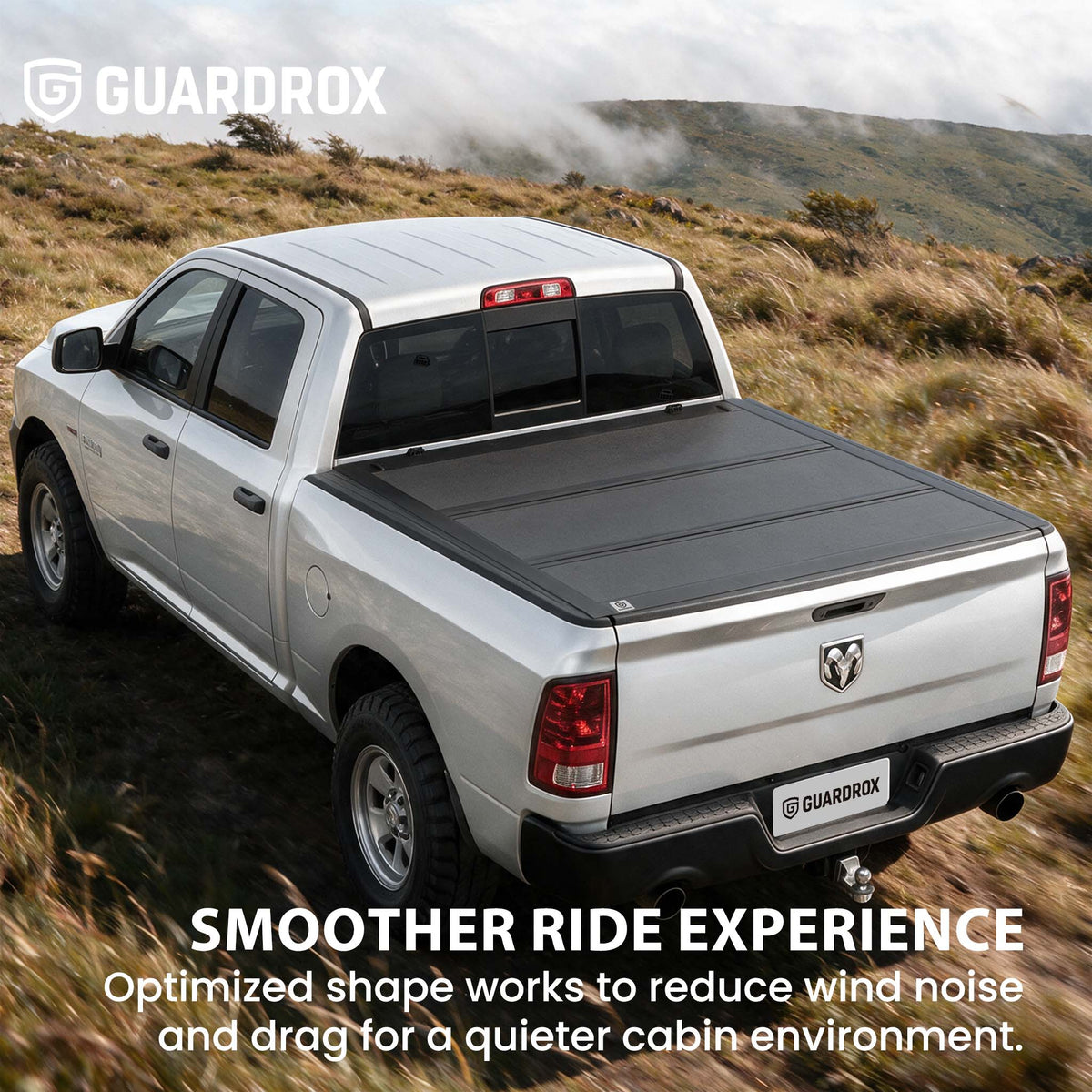 Hard truck bed cover riding steady on a pickup cruising a mountain highway for better fuel economy