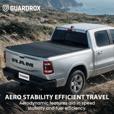 Hard truck bed cover riding steady on a pickup cruising a mountain highway for better fuel economy