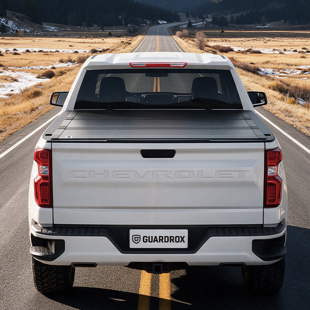 Chevy Silverado 1500 with the LX5 flip up cover exploring a gravel mountain trail