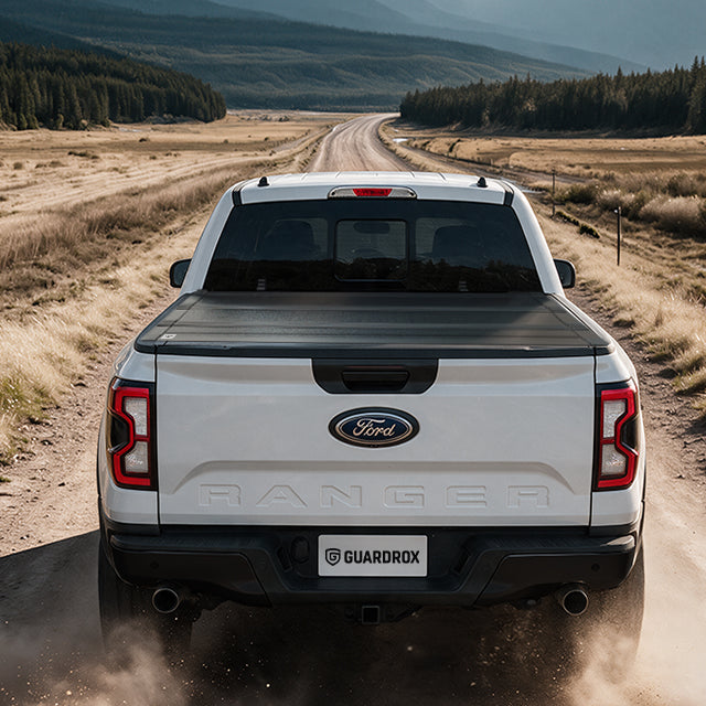 Ford Ranger with the LX5 flip up cover exploring a gravel mountain trail